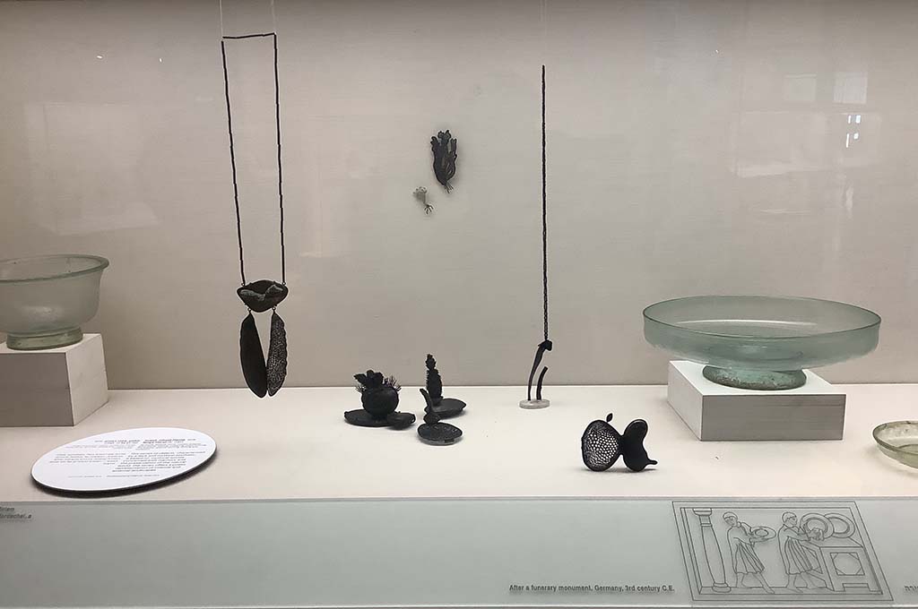 Image from the Biennale of craft and design at the glass department geologic items beside contemporrary works